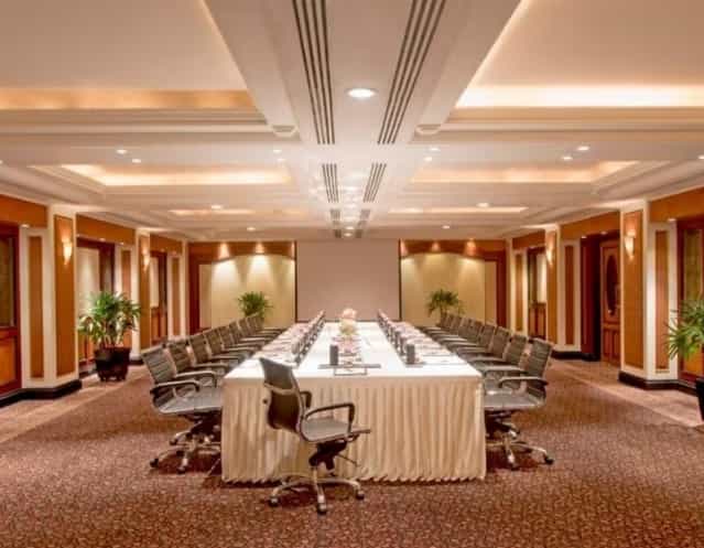 Meeting room at Taj Lands End Mumbai with long table, ideal for corporate events.
