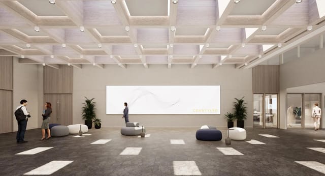 Modern event venue Scala with high ceilings for networking and meetings.