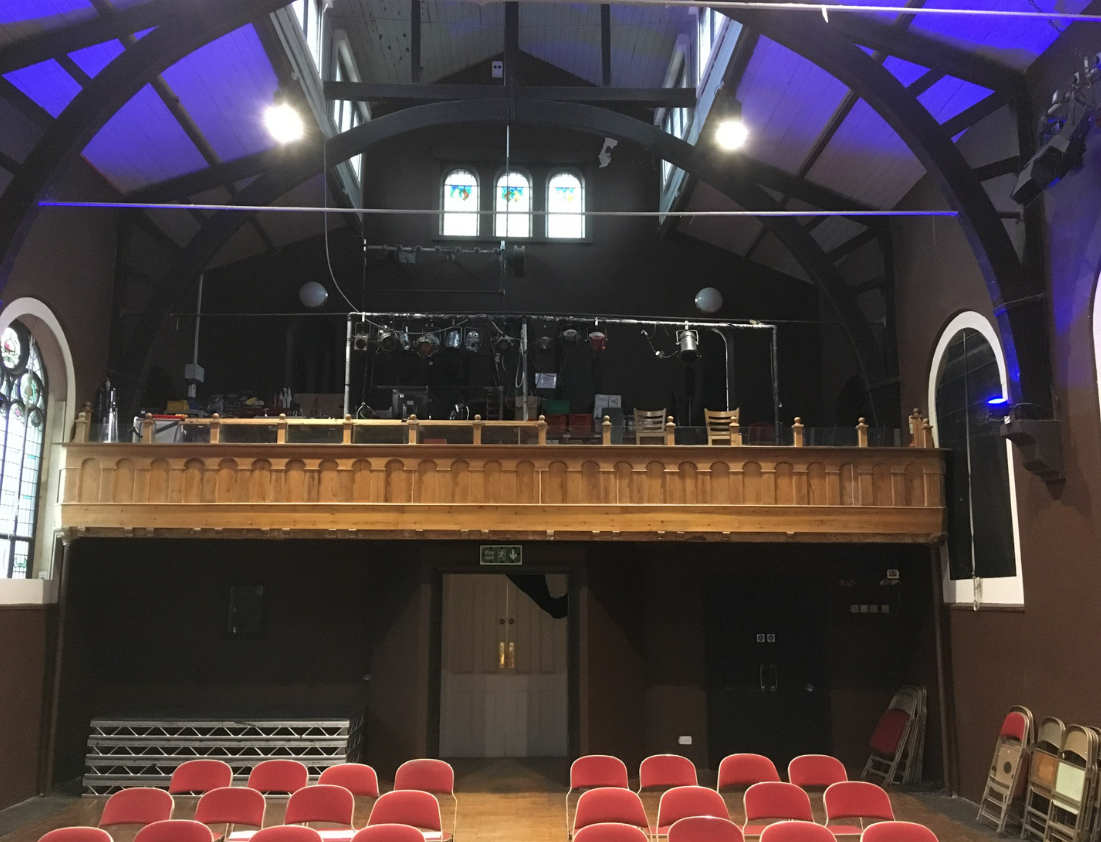 Main Hall in The Space, versatile venue with elevated balcony for events and performances.