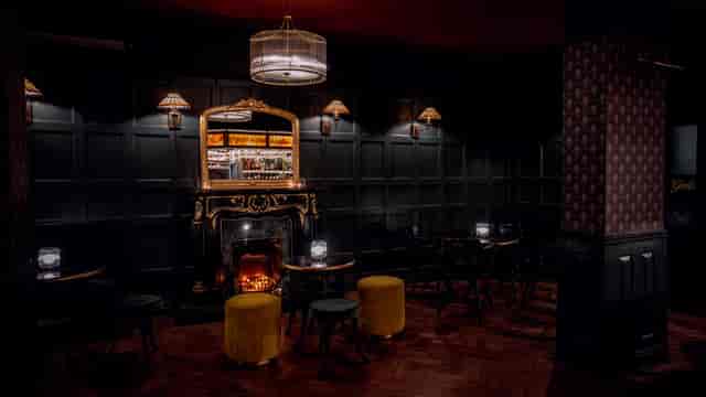 Luxury lounge with fireplace for VIP receptions and exclusive networking events.