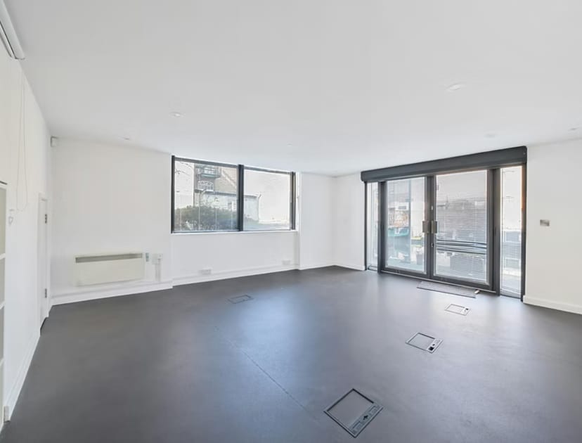 Versatile event space with natural light, perfect for meetings and workshops.