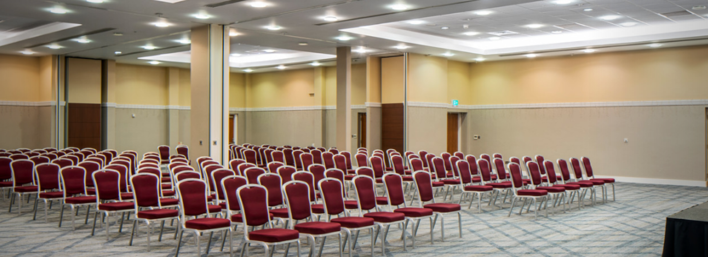 Coalport Suite conference room with red and gold chairs, ideal for workshops and presentations. - Banner