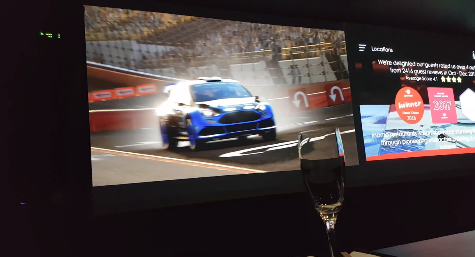 Private dining room with racing visuals for upscale corporate events and product launches.