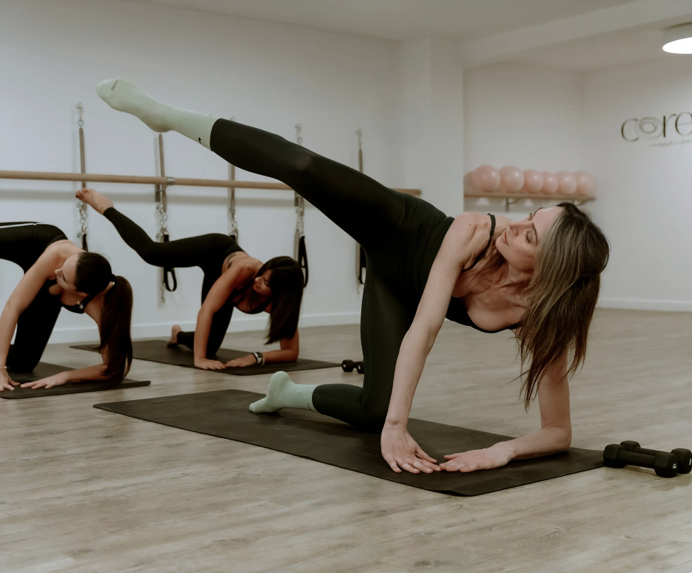 Fitness class in a modern studio, ideal for corporate wellness events and retreats.