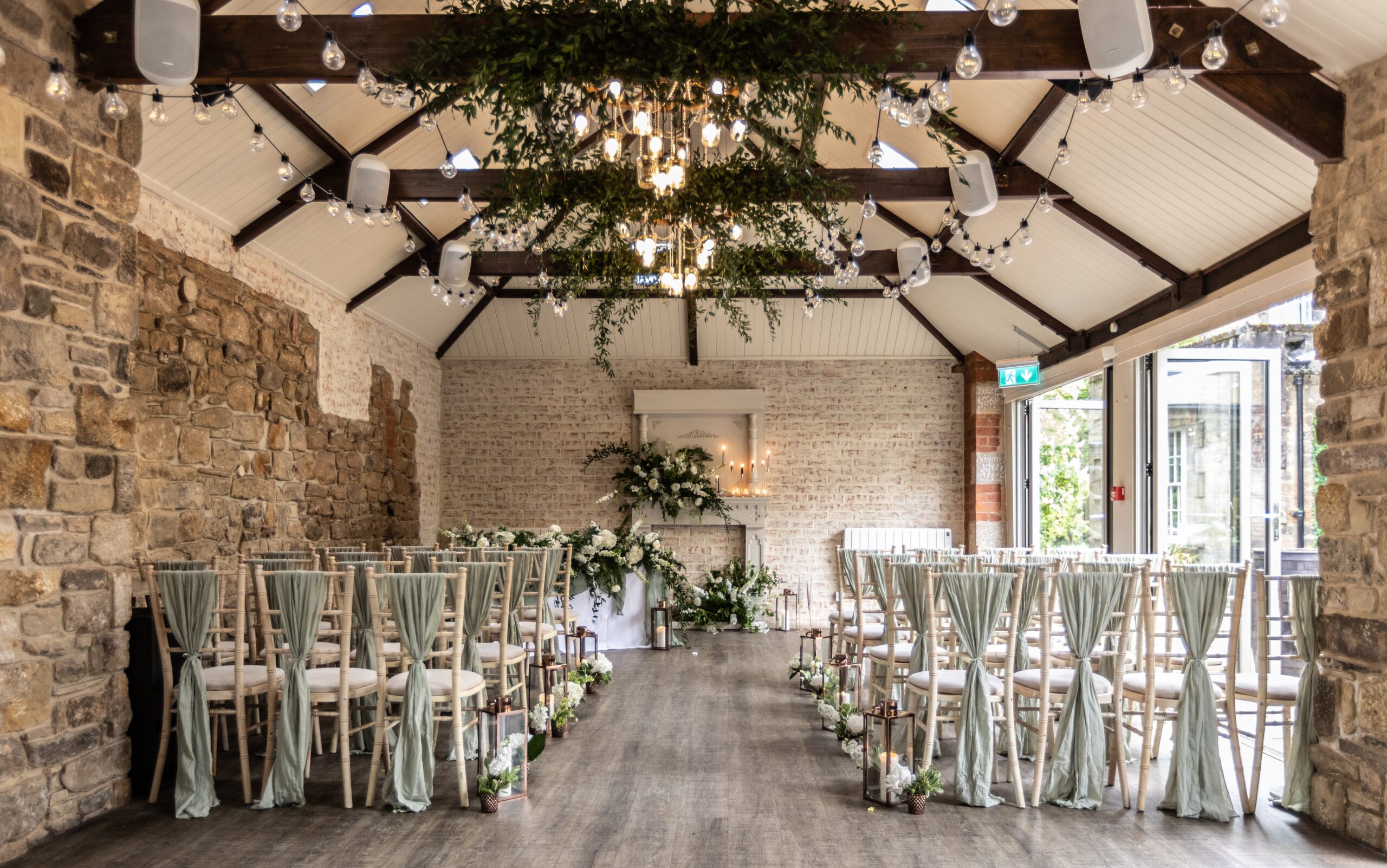 Elegant event space at Coach House & Manor, featuring wooden beams for weddings and gatherings.