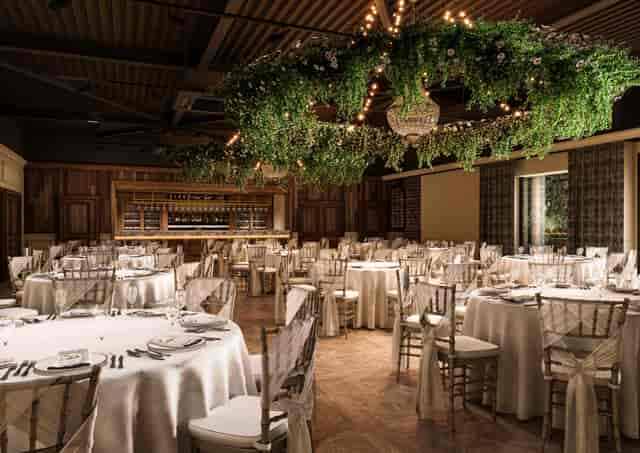 Elegant banquet setup with round tables, perfect for weddings or upscale events in Newton Hall.