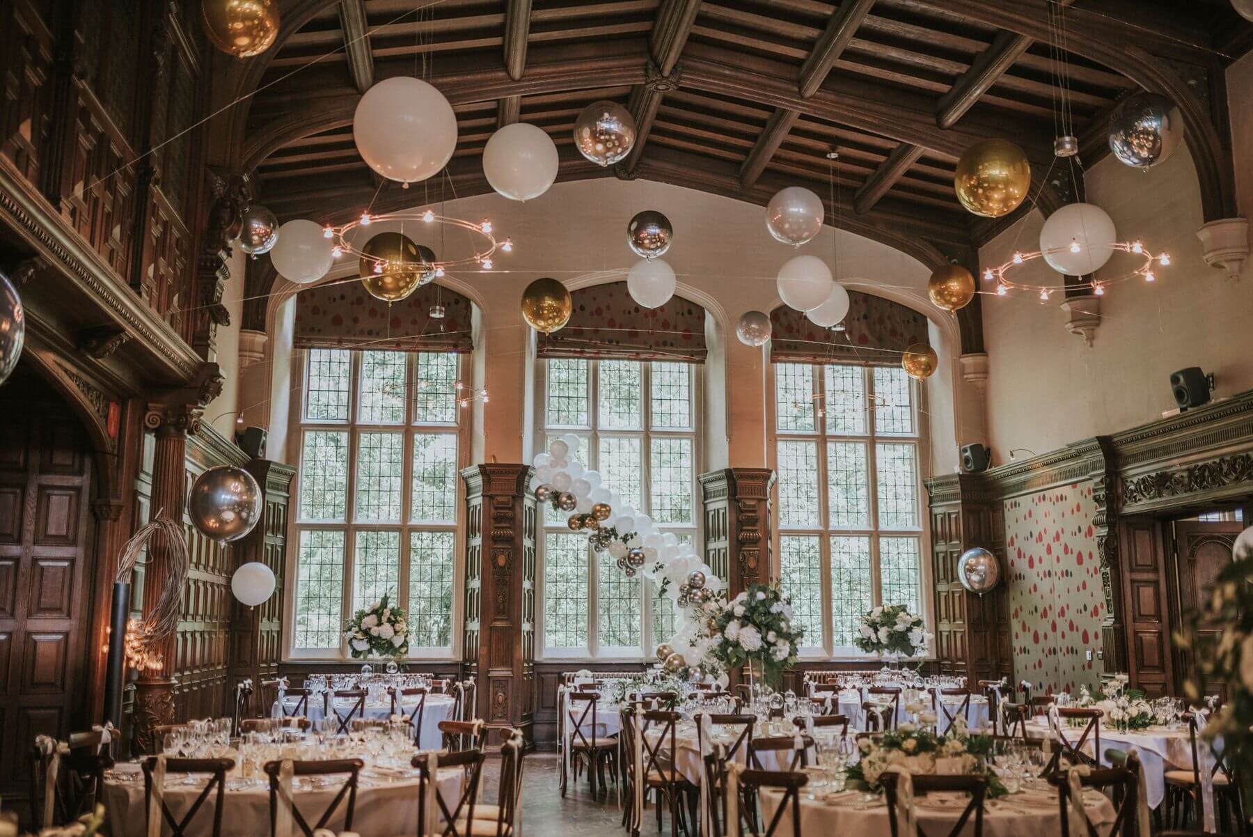 Celestial balloon decor in Jesmond Dene House Great Hall for gala dinner and luxury event.