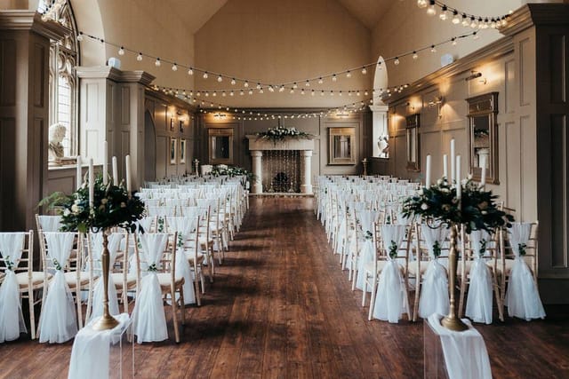 Olive House at Ellingham Hall: Intimate wedding ceremony venue with elegant floral decor.