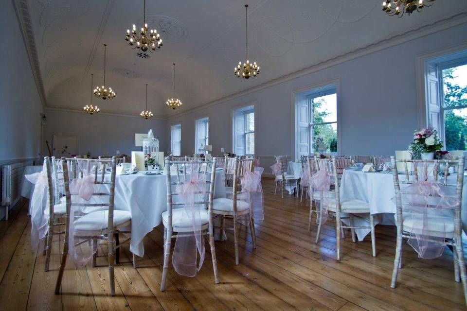 Great Hall at Hexham Abbey with elegant chandeliers, ideal for weddings and events.