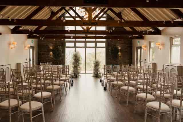 Rustic-chic wedding ceremony setup in Marshall Meadows Manor House Main Suite with Chiavari chairs.