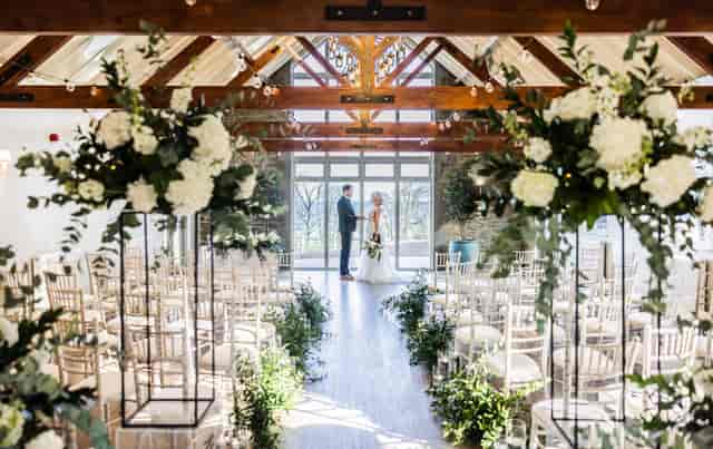 Marshall Meadows Manor House wedding ceremony, rustic-luxe aisle with floral decor.
