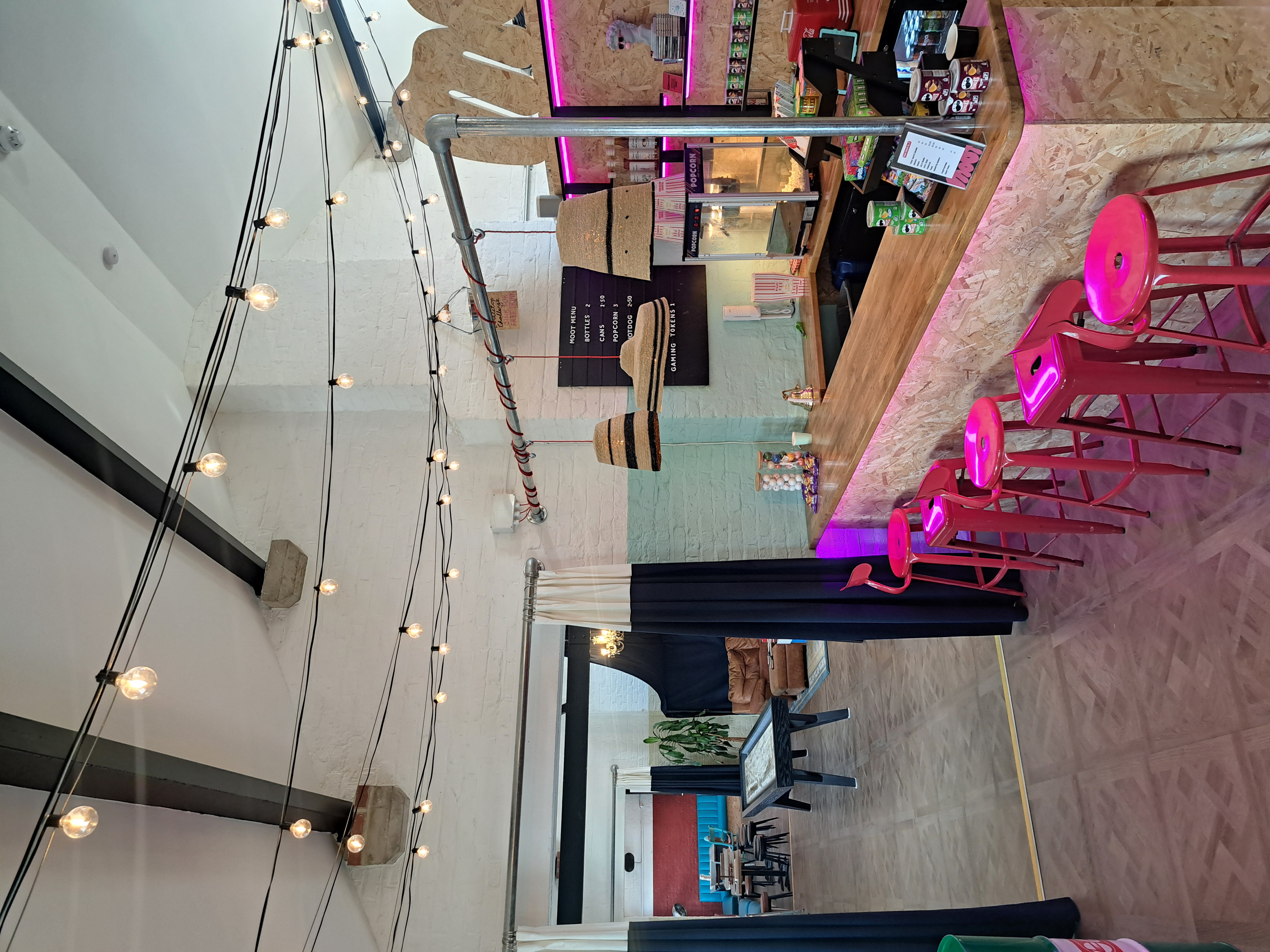 Moot Main Event Room with rustic bar and soft seating for corporate networking and team building.