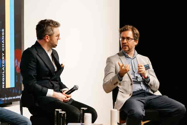 Panel discussion in Auditorium, York Road, showcasing engaged speakers and professional networking.