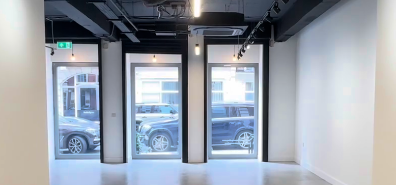 Modern event space at St George Street Gallery with natural light and versatile setup. - Banner