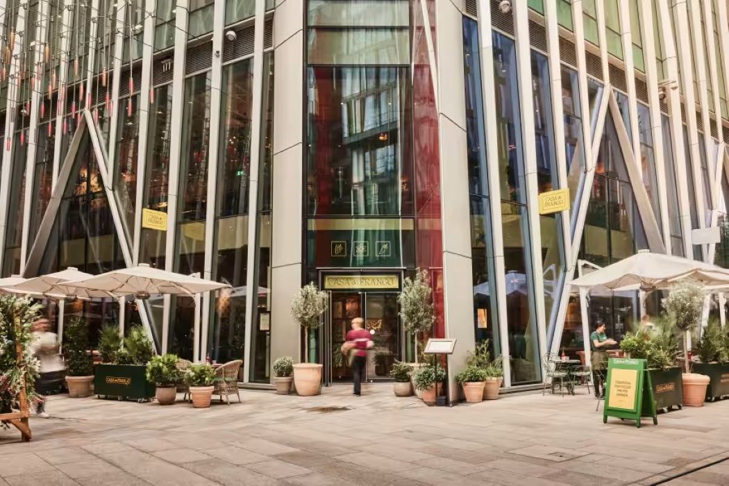 Modern venue hire at Casa do Frango Victoria, featuring glass facade and outdoor seating. - Banner