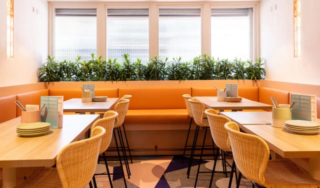 Modern dining area at Atico, Fonda Mexican, perfect for networking and casual gatherings.