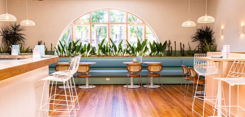 Modern venue with natural light, perfect for casual meetings and networking events.