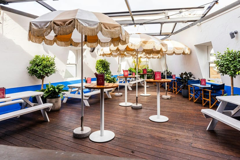 Rooftop event space at Taphouse Sydney with charming parasols for relaxed gatherings.