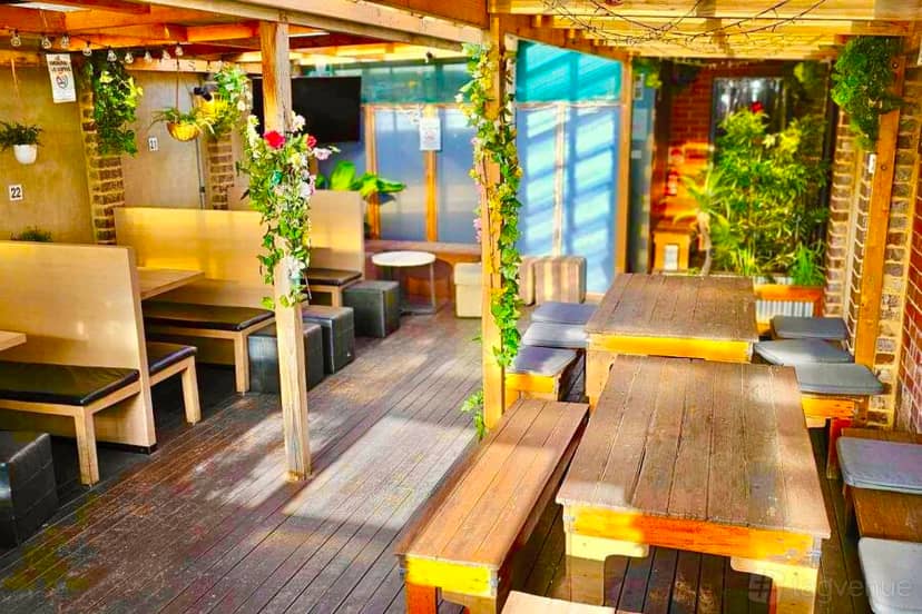 Outdoor meeting space at The Purple Emerald Lounge Bar for casual gatherings and events.