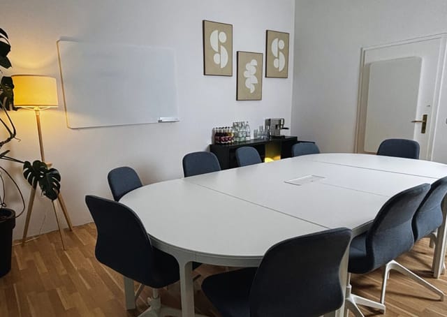 Modern seminar room with circular table for productive meetings and workshops.