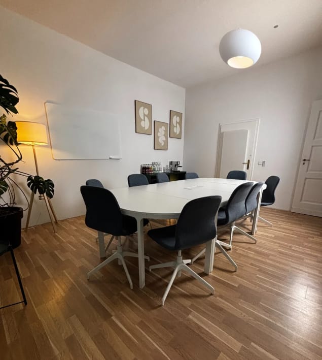 Modern seminar room with round table for collaborative meetings and workshops.