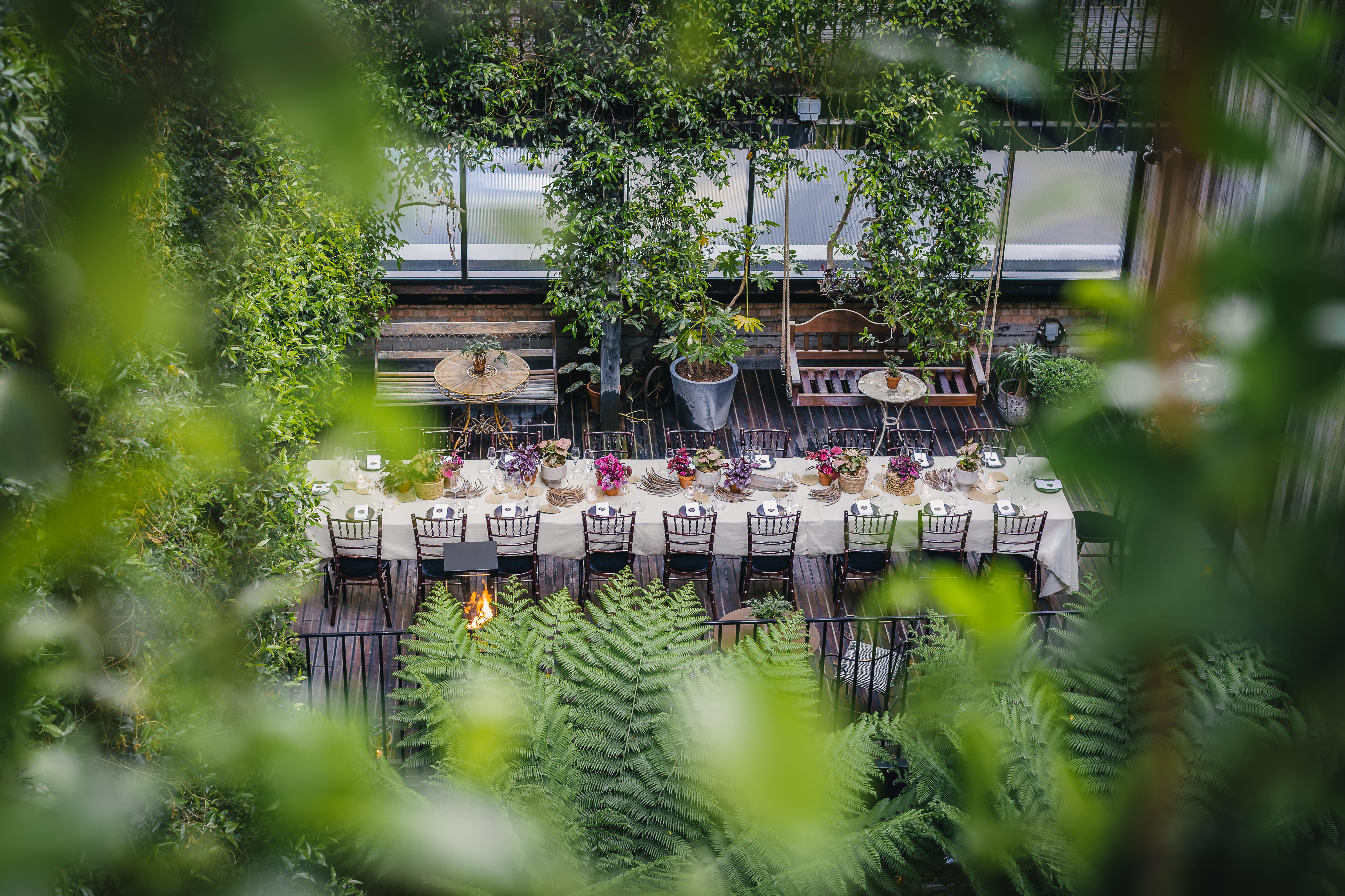 Lush Jurema Terrace at The Mandrake for intimate alfresco private dining and luxury event hire. - Banner