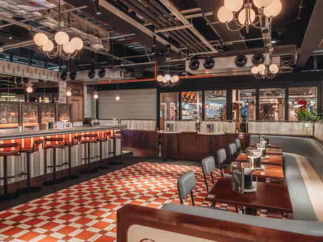Full Venue Hire in Arcade Battersea, stylish bar area, ideal for networking events.