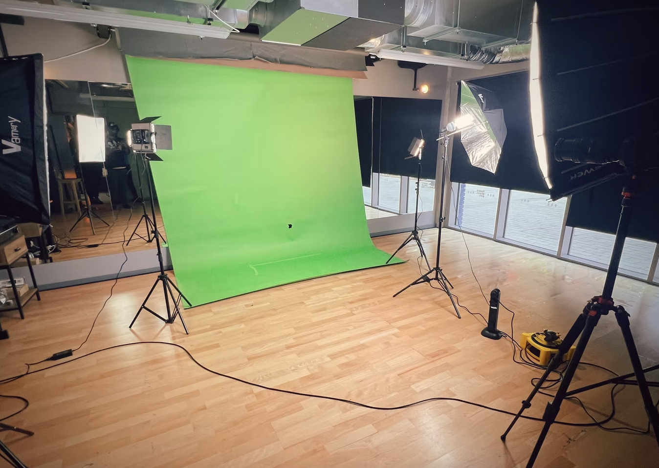 Multi-purpose studio with green screen backdrop for webinars and streaming events.