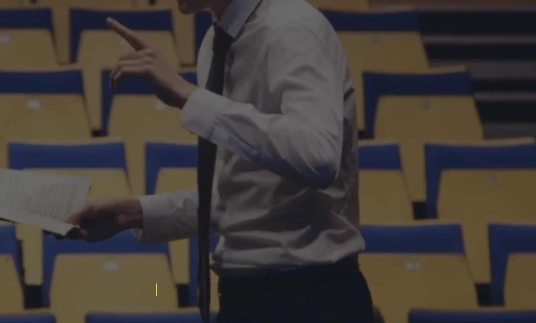 Presenter in Latymer Upper School's Main Hall during an engaging event presentation.