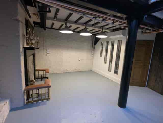 Industrial basement event venue with exposed ceilings for pop-ups and creative workshops.