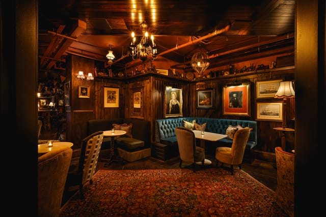 Elegant meeting space with wood paneling for intimate gatherings and events at Mr Fogg's.