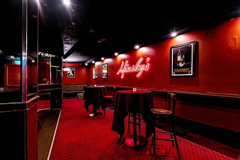 Piano Bar at Minskys Hotel: Speakeasy event space with neon lighting for intimate receptions.