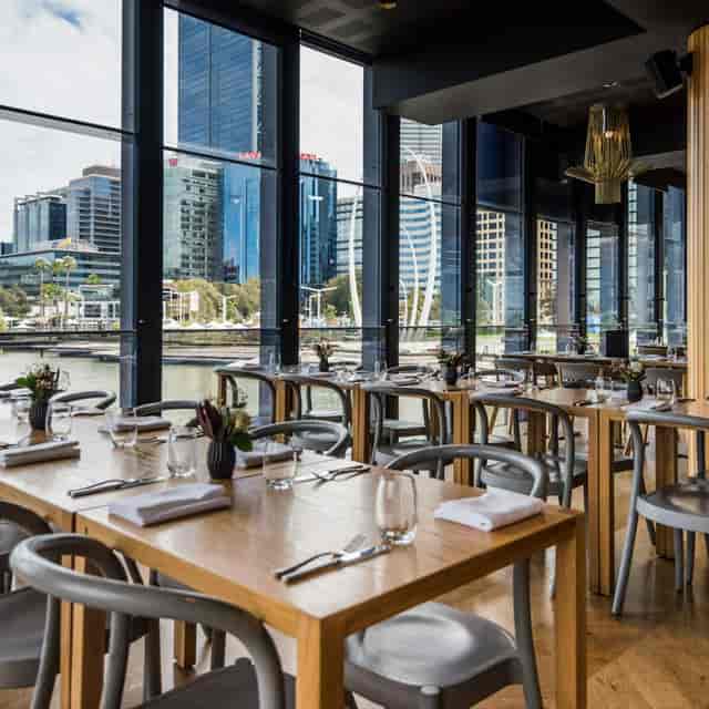 Low Kee Dining Room: minimalist corporate lunch venue with floor-to-ceiling waterfront views.