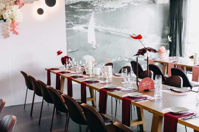 Low Kee Dining Room with burgundy linens set for an intimate private dining or corporate event.