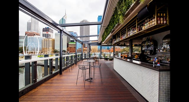 Henry's Rooftop Bar in The Reveley: Open-air corporate cocktail venue with skyline views.