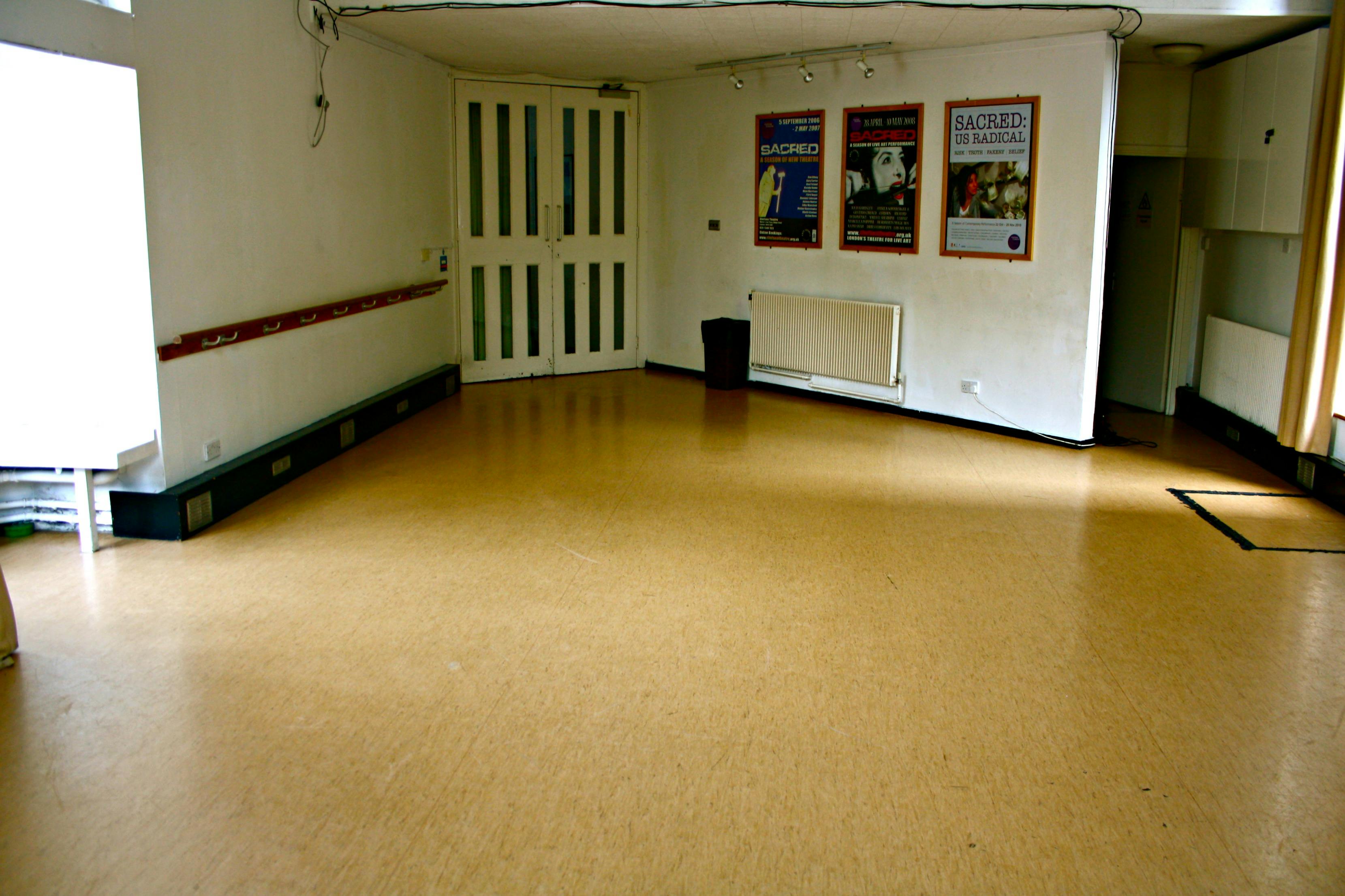 Spacious empty meeting room in Chelsea Theatre, ideal for workshops and presentations.