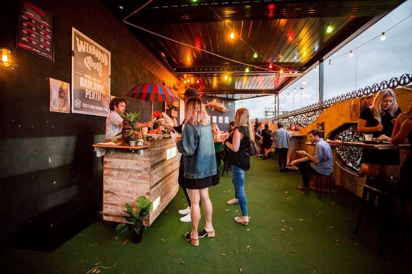 Badlands Main Room rooftop bar with festoon lighting for networking events and social mixers.