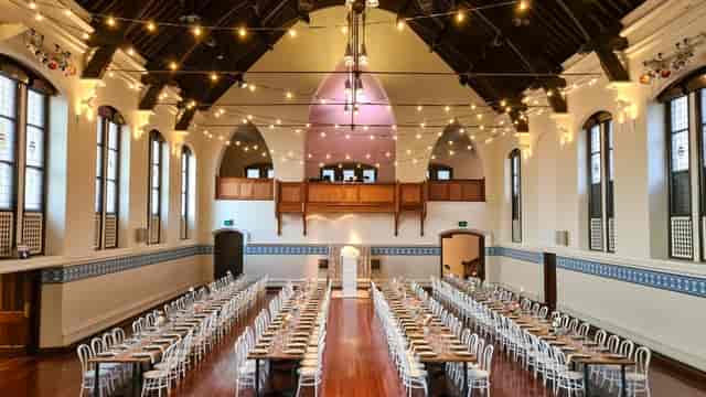Banquet setup in Perth Town Hall, featuring bistro lighting for historic event venue hire.