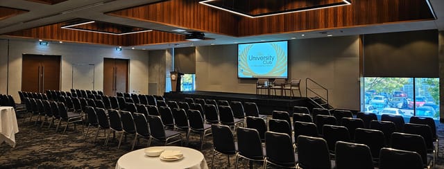 Theater-style seminar room at The University Club of WA for corporate presentations and forums.