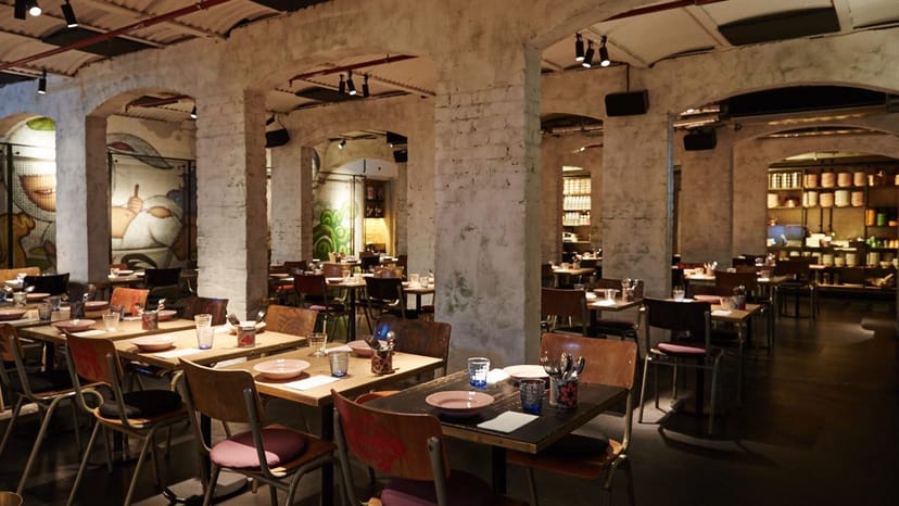 Long Chim industrial venue with exposed architecture, ideal for networking and corporate dining.