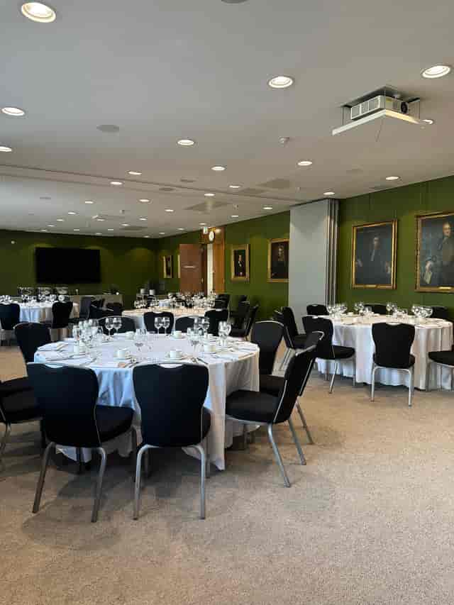 Elegant event space at RCP London with round tables, perfect for corporate dinners.