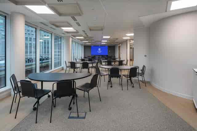 The Pavilion at Ellisse: collaborative breakout space with semi-circle tables for corporate events.