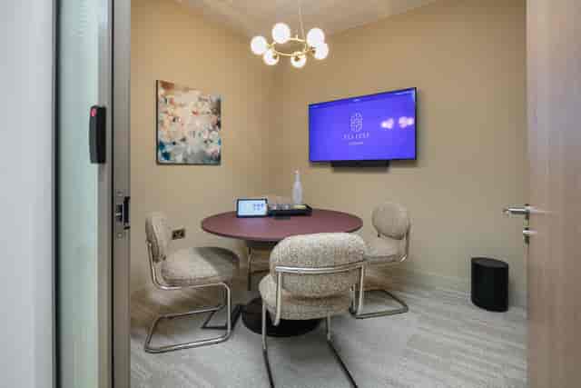 The Pavilion at Ellisse: Intimate huddle room with integrated AV for professional breakout sessions.