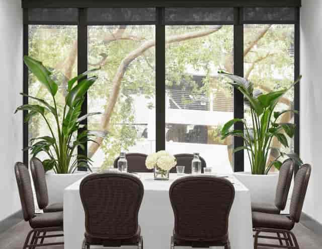 Elegant meeting space with natural light for collaborative events and gatherings.