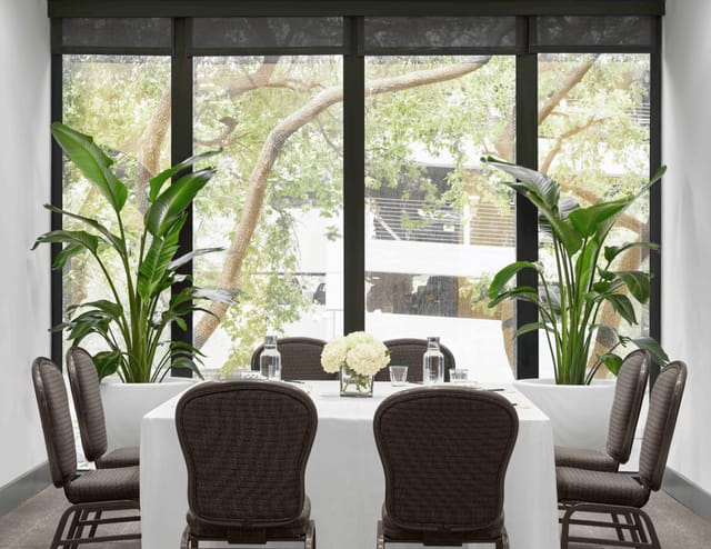 Elegant meeting space with natural light for collaborative events and gatherings.
