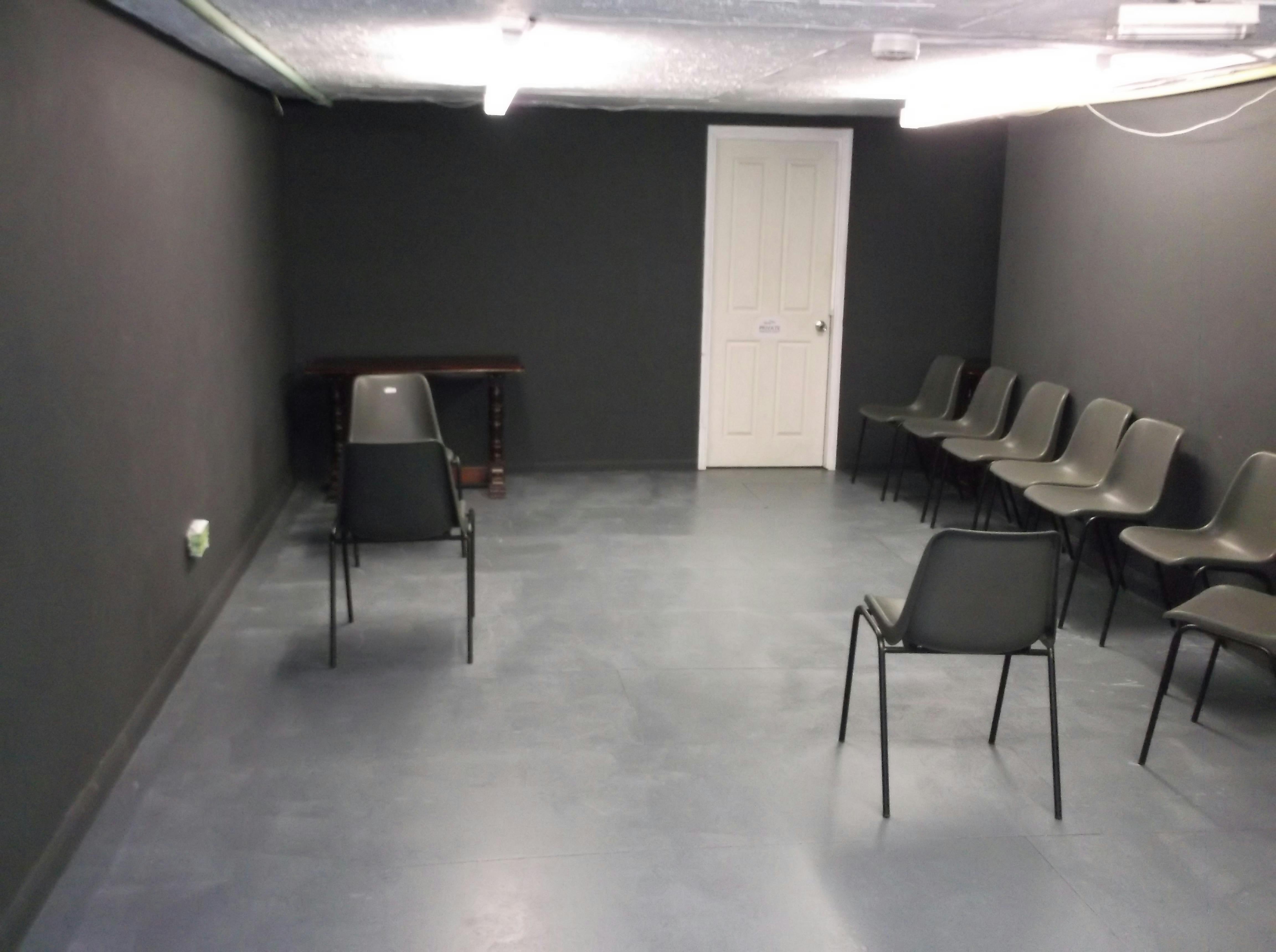 Minimalist meeting space in The Basement, ideal for workshops and discussions.