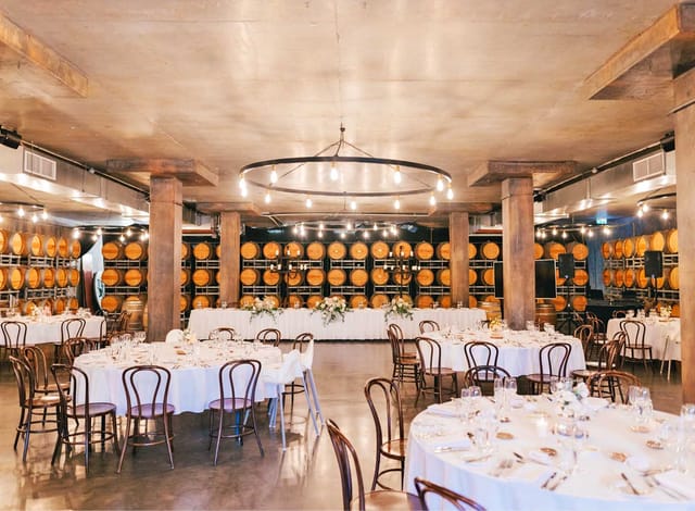 Sandalera Room at Sandalford Wines: industrial wine-country event space with barrel wall decor.