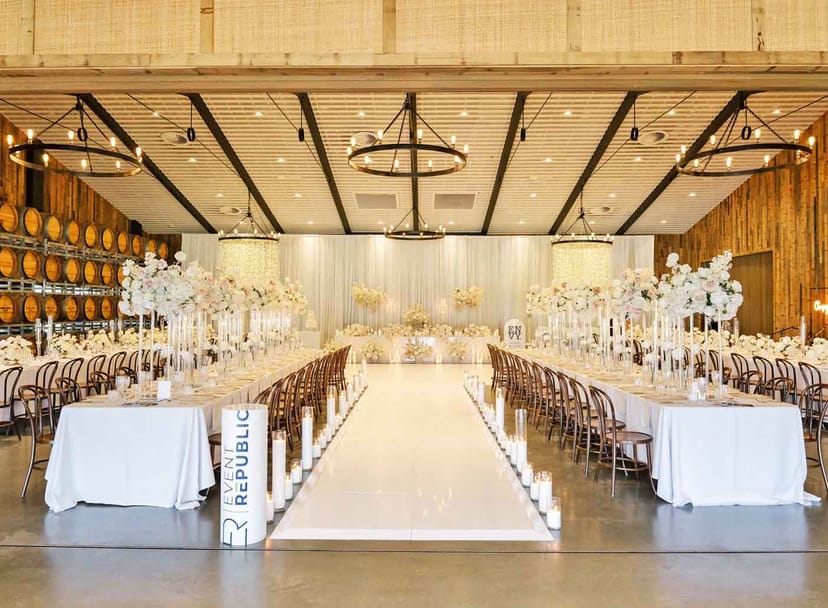 Rustic Sandalera Room wedding venue at Sandalford Wines with elegant floral aisle decor.