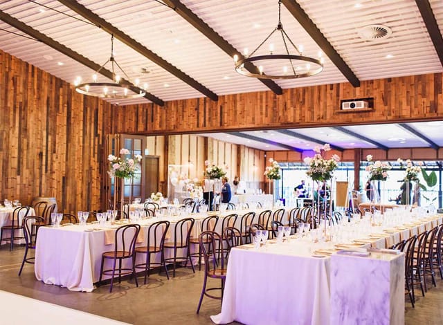 Hill House banquet hall with wood-paneled walls, ideal for rustic-chic gala and wedding events.