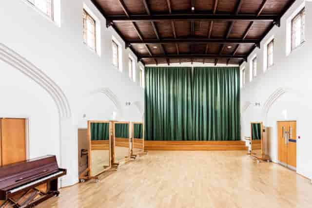 St Paul's Cambridge Upper Hall: versatile venue with timber-paneled ceilings for events, workshops.